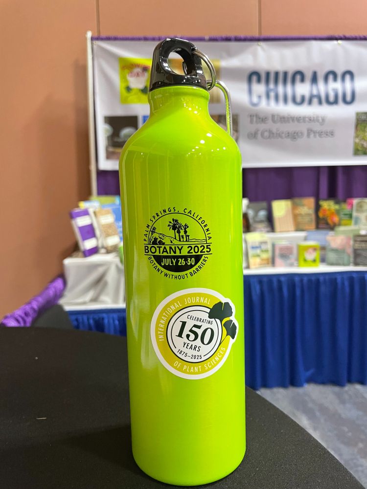 Chartreuse water bottle with IJPS@150 sticker on it.