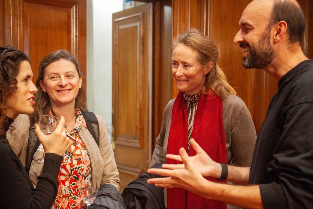 Rebecca Tobi of The Food Foundation and three attendees of the launch speak in a circle before the session begins at the launch of the findings of the Reckoning with Regeneration project on 10 November. Photo by Jacquelyn Turner.
