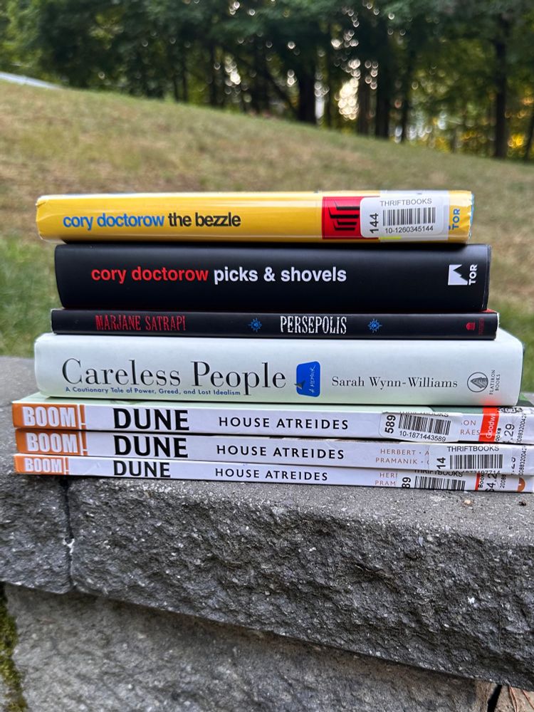Stack of books on a wall.