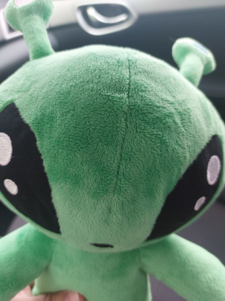 Close up photo of ikea alien plush head