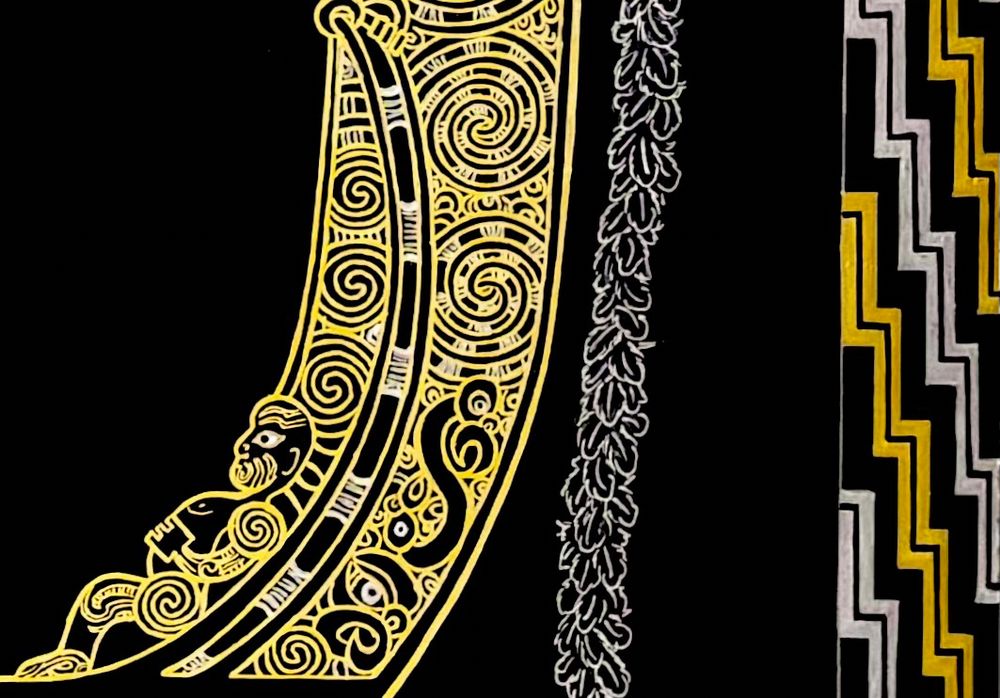 Close up of the ornately carved stern of the waka. Attached to it is a silver feather streamer, called a puhi-rere.