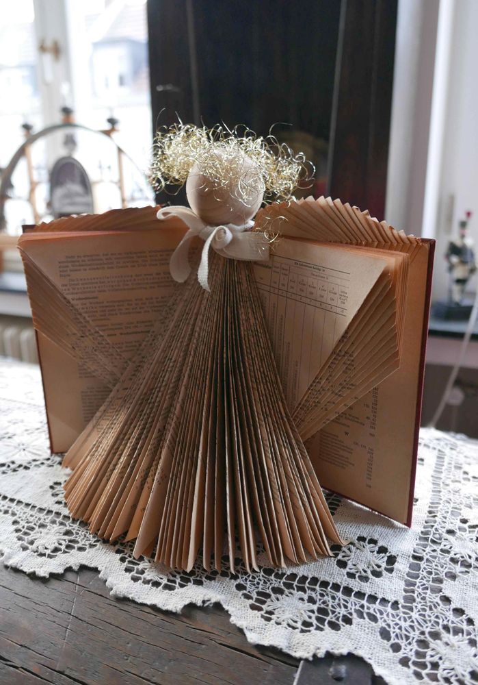 Photo of an Angel made from folding the pages of a book. Photo taken by Geolina163, CC BY-SA 4.0 https://creativecommons.org/licenses/by-sa/4.0, via Wikimedia Commons