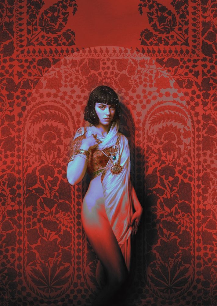 Digital painting of a woman against an orange pattern background.