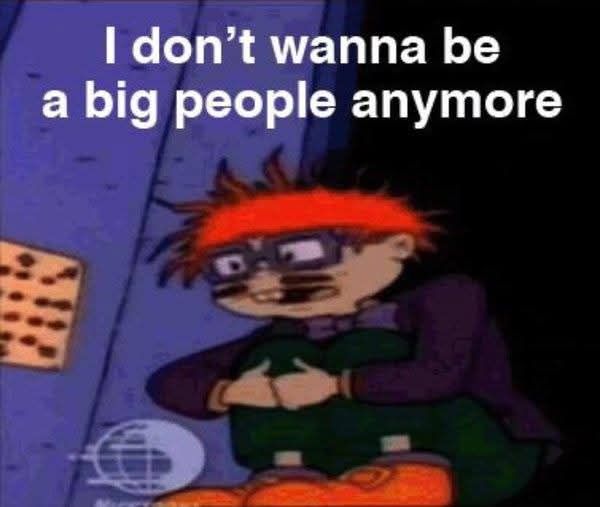 Adult Chucky from Rugrats is a cartoon character with messy red hair, glasses, and a distressed expression. He is sitting on the floor hugging his knees. The image is dark and gives a moody, overwhelmed vibe. Text at the top reads, "I don't wanna be a big people anymore."

