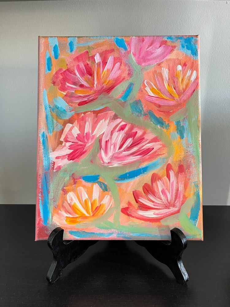 A colorful painting of red, orange and pink abstract flowers on a blue and light green background. 