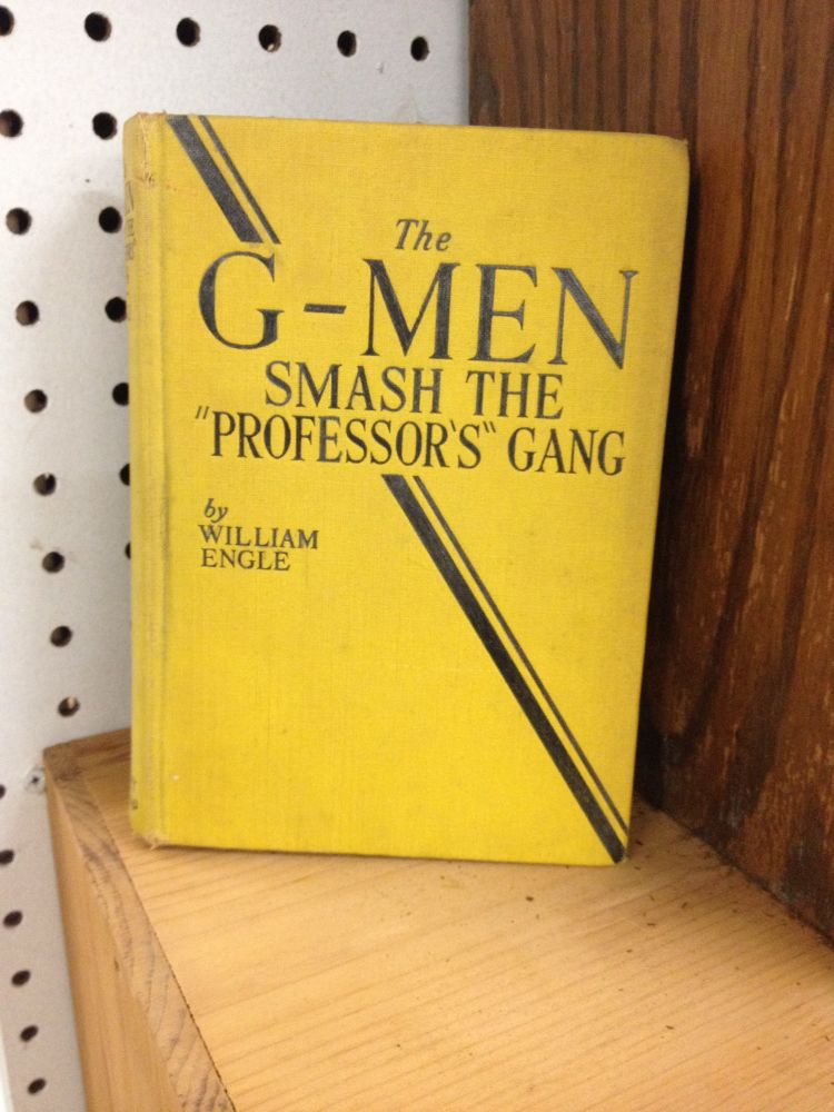 Photo of a books called “The G-Men Smash the ‘Professor’s’ Gang by William Engle. 
