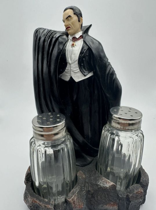Two boring-ass glass salt and pepper shakers in an elaborate salt and pepper shaker caddy shaped like Dracula. 