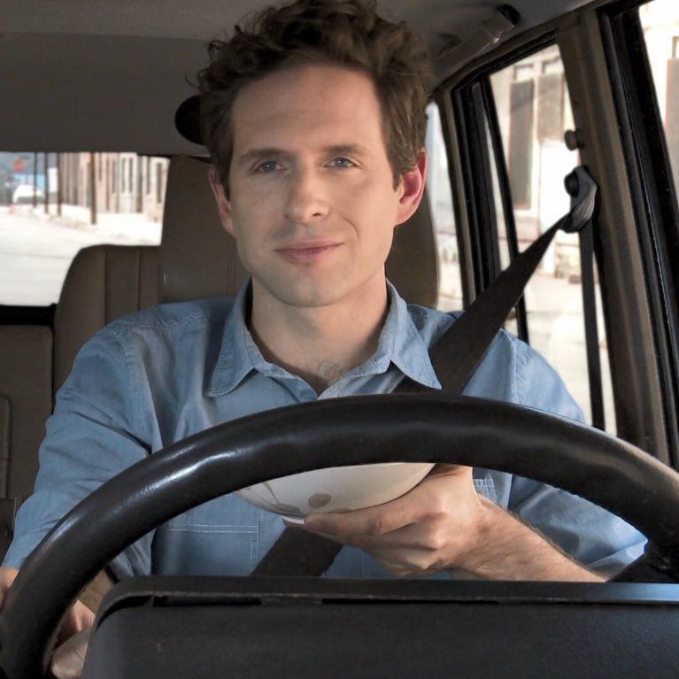 Dennis Reynolds eating cereal while driving