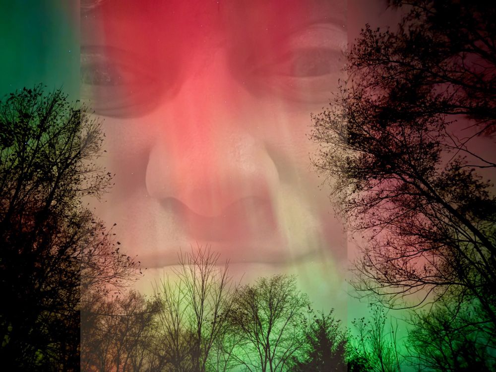The Smiling Man inside an aurora borealis