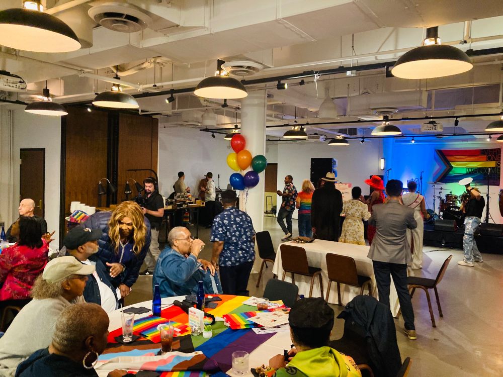 A full room. Dancing, food, and festivities. All for Silver Pride!