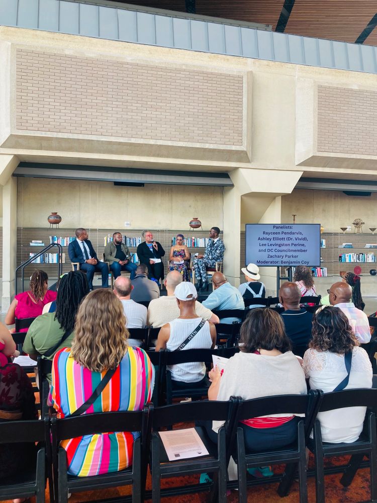 The panel speaks to a full colorful room. 