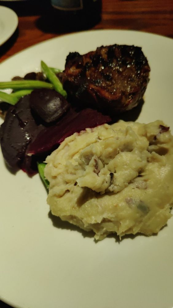 The Kegs mashed potatoes in front (mashed potatoes with bacon bits), beets, green beans and mushrooms behind it and to the left, and behind and to the right is a 7oz filet mignon. 