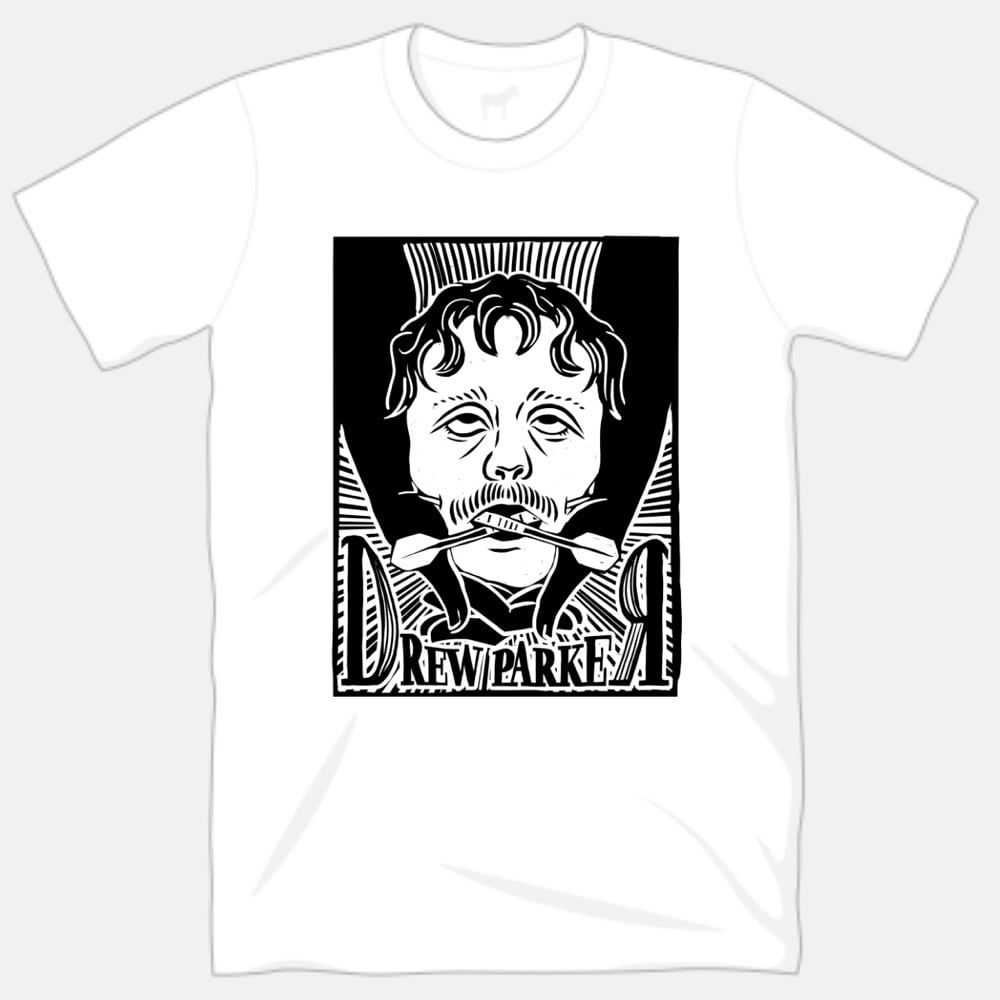 A mock up of a white tshirt with the design from the lino on the front
