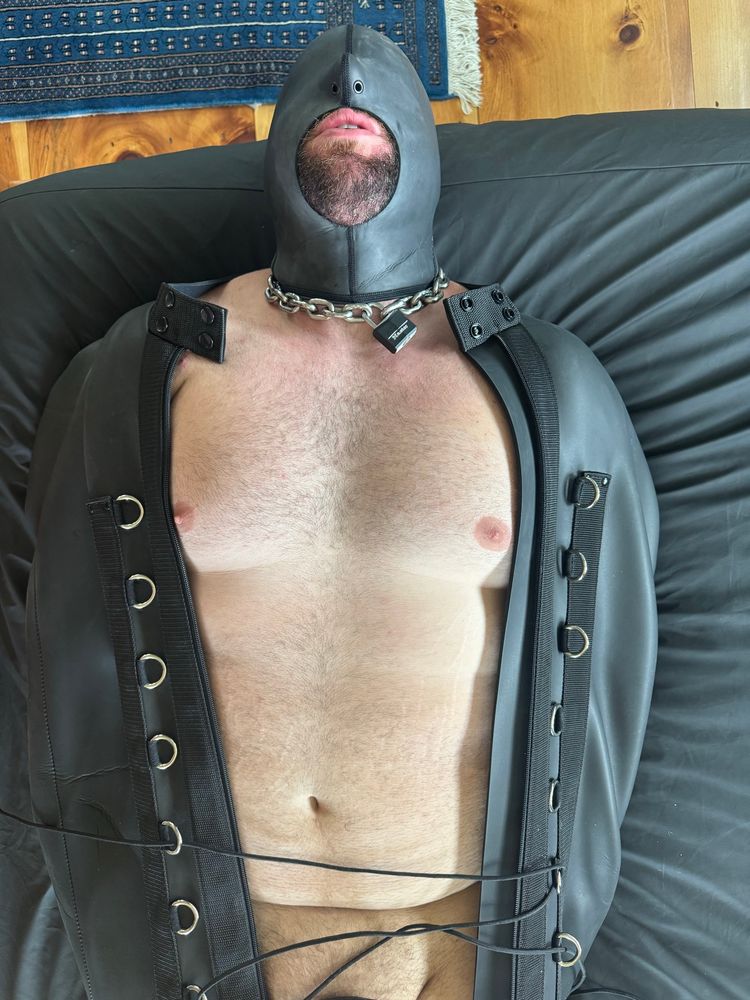 A beefy Switchybear94 hooded and going into the sleepsack for a session of bound throat training with Coach