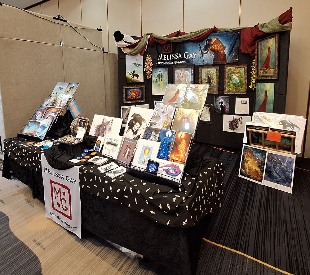 Another view of my vendor space, this time showing the flip bin bearing the 13x19" prints, all the way to the right. My table runner has honey bees on it, because that's what my name means. :)