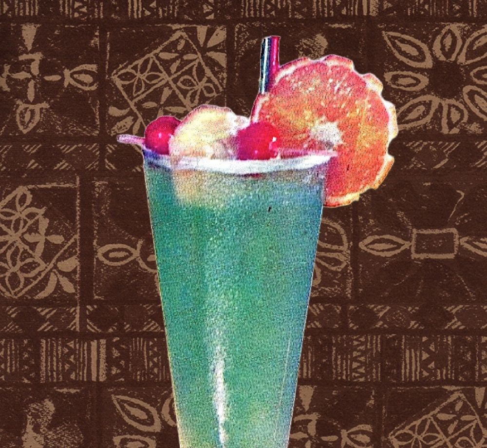 photocomposition of a green punch in a pilsner glass with straw and fruit garnishes over a rustic woven textile