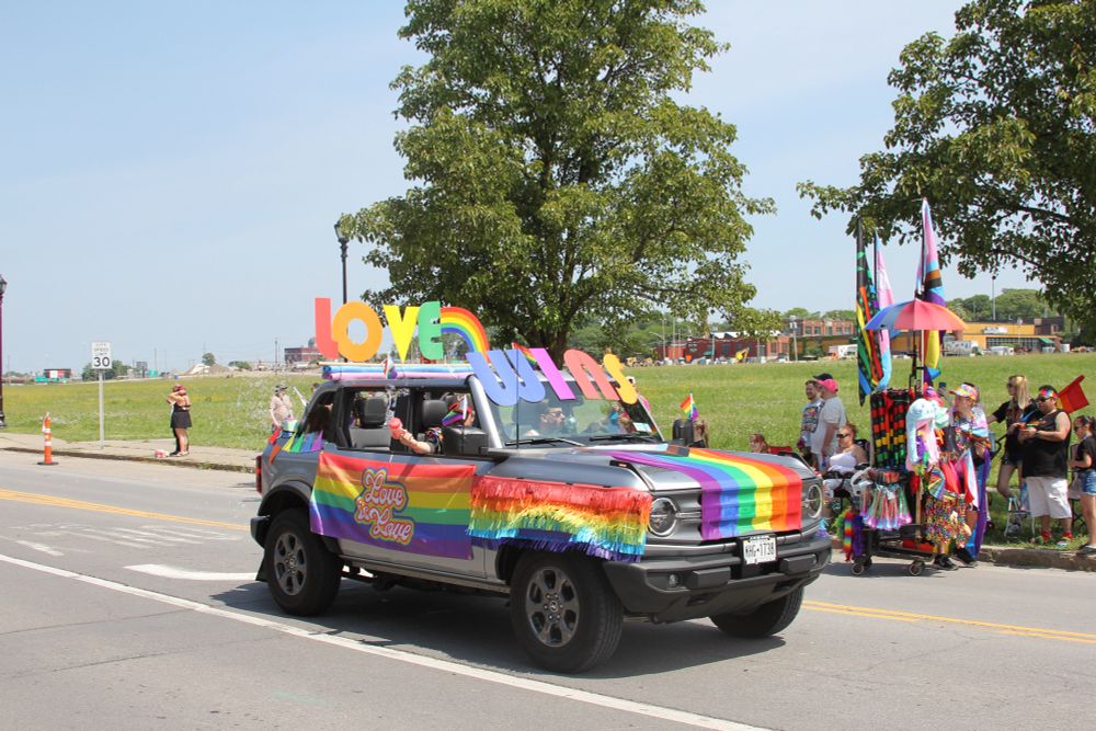 Rainbow car that says Love Wins. 