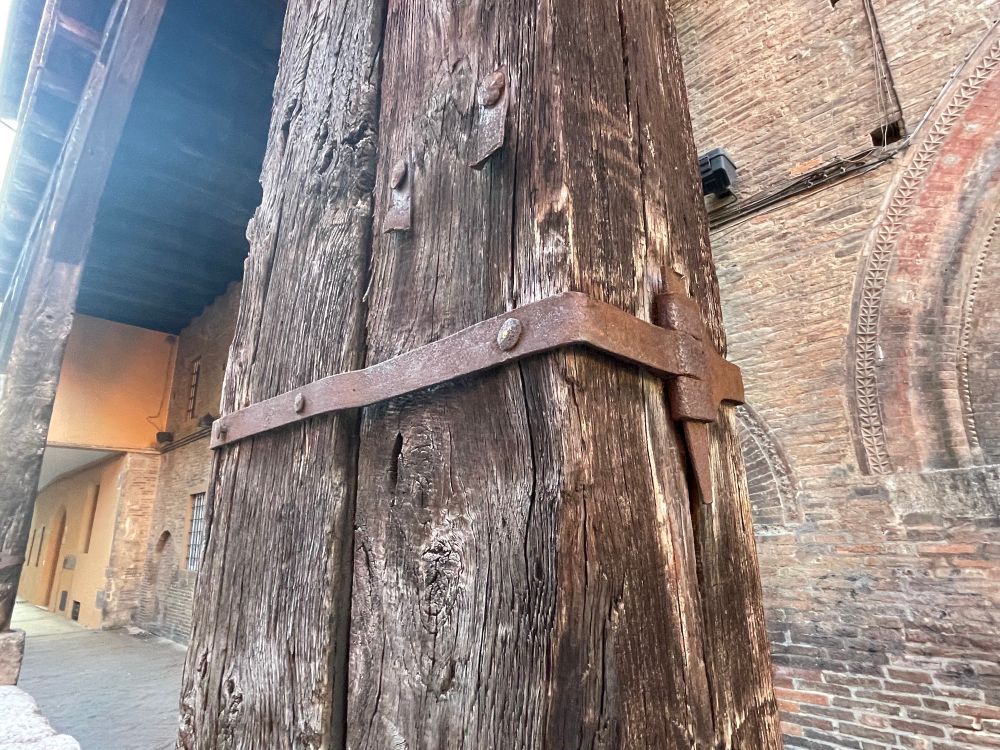 Iron restraint holding two large posts together