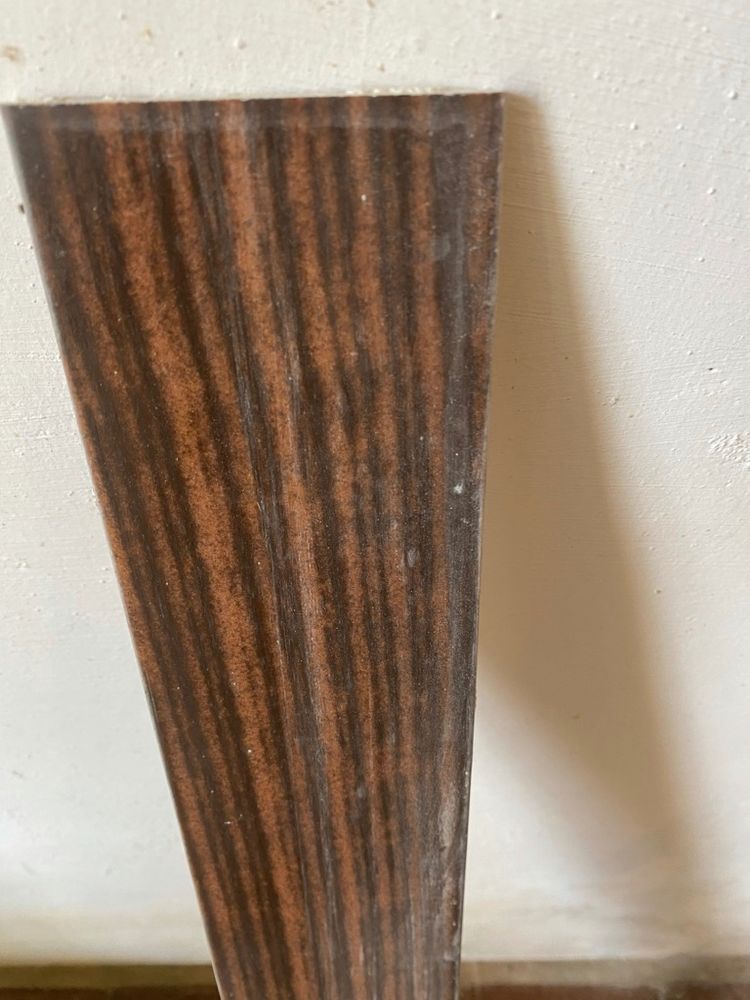 Some sort of resin material in imitation of natural dark wood