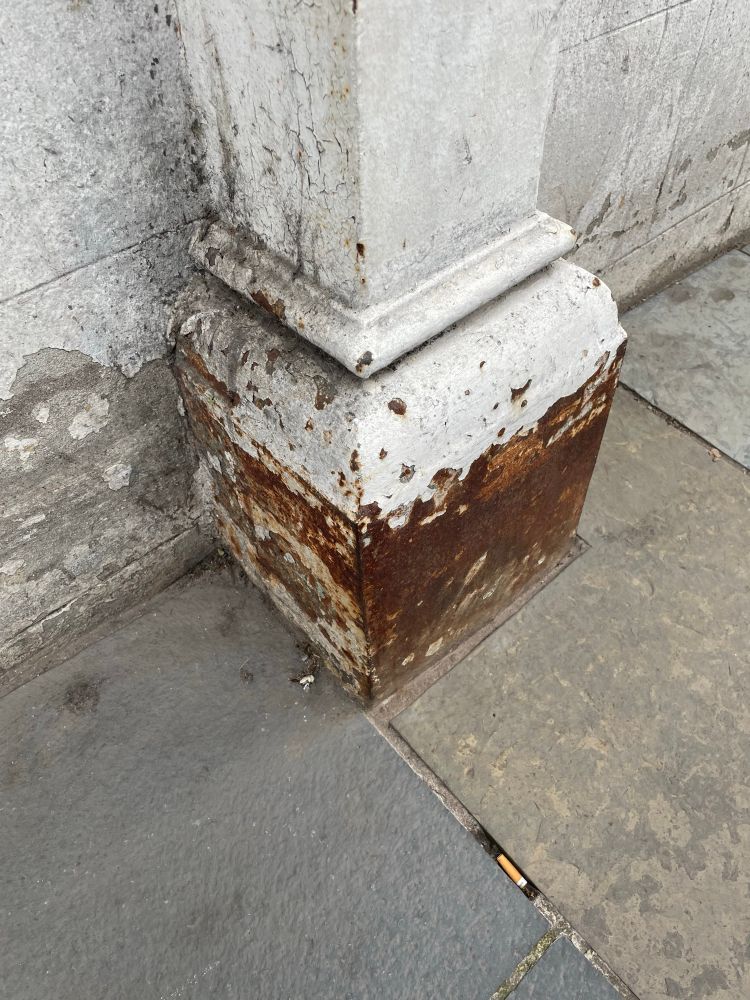 The base of a pilaster showing rust
