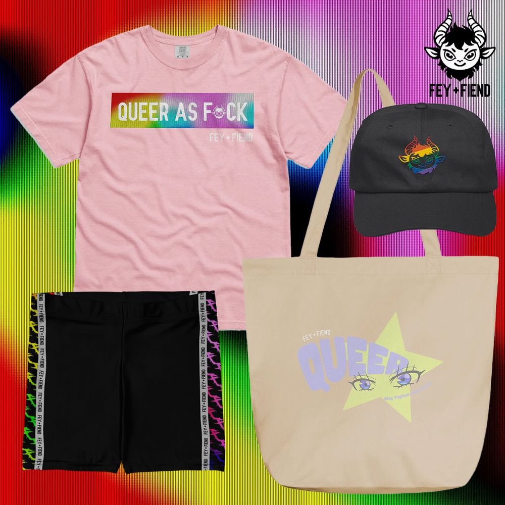 F+F Pride collection shot featuring Queer as fuck pink shirt, rainbow logo black hat, rainbow side panel biker shorts, and Queer beige tote bag