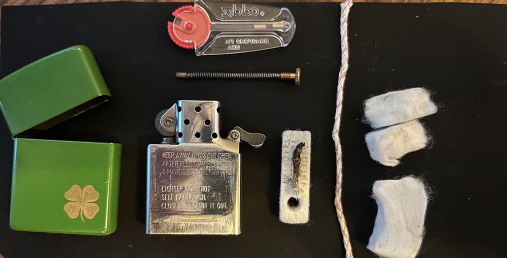 A disassembled zippo lighter