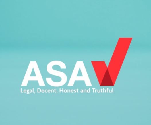 Photograph of the ASA logo, with the text "ASA" in white, followed by "Legal, Decent, Honest and Truthful" in a smaller font size, and a red check mark. The background is light blue.