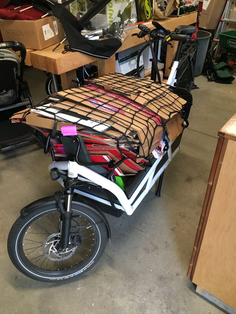 Cargo bike with a load of flattened cardboard destined for the recycling depot. 