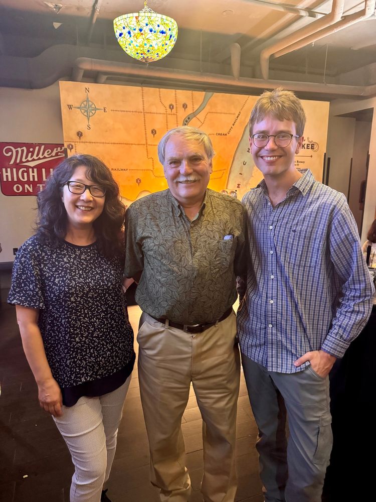 Sue Rhee, Frank Telewski, and Jannis Jac​obs standing together smiling.  