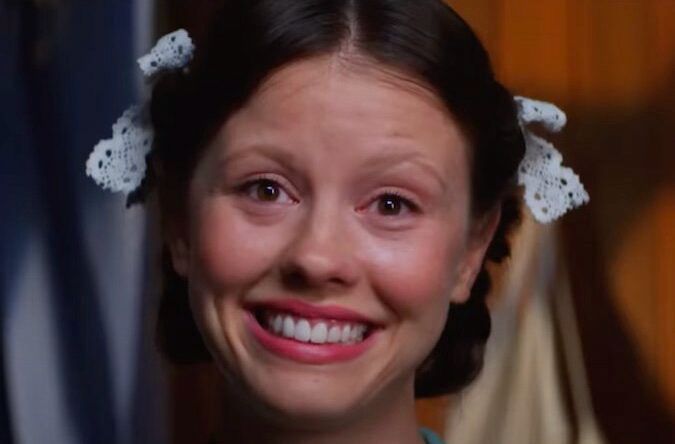 Mia goth as pearl smiling 