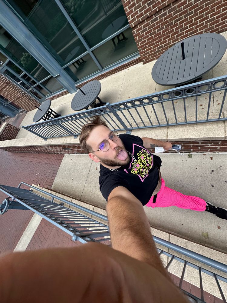 me strutting in pink pants and a Keith Haring crop tongue out 