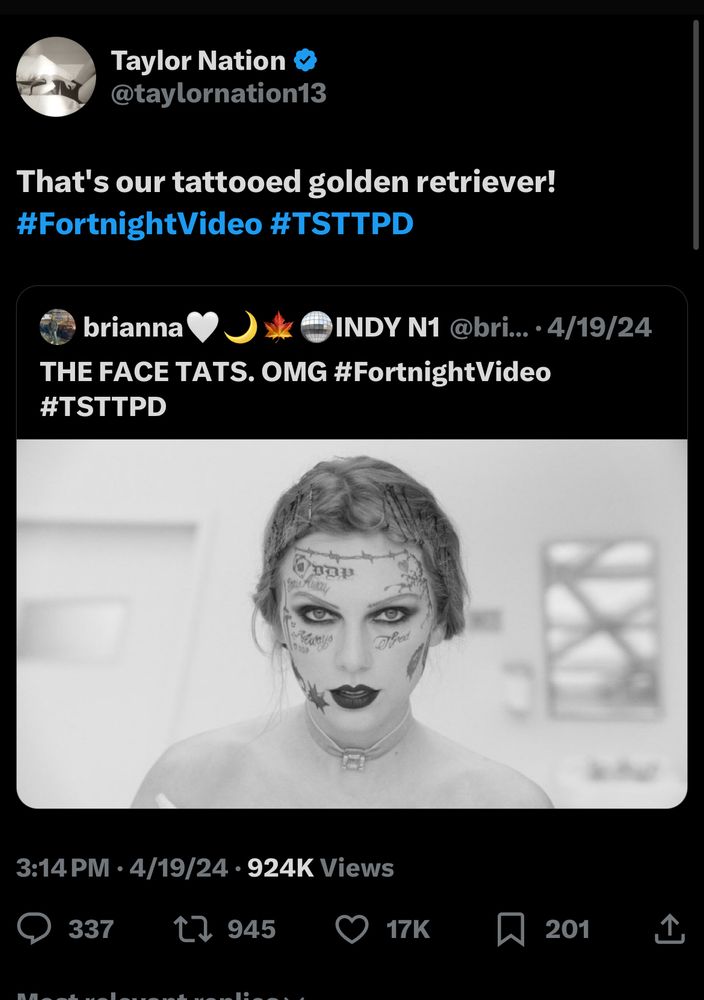Screenshot of a tweet from Taylor Nation quote tweeting a picture of Taylor from the fortnight video with tattoos covering her face. Taylor Nation says “that’s our tattooed golden retriever! #FortnightVideo #TSTTPD