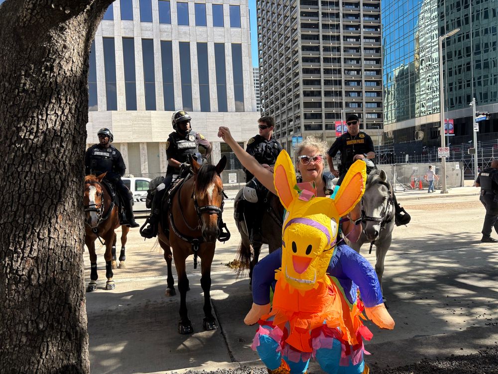 Me in riding an inflatable piñata in front of Houston police on horseback. They are not smiling 