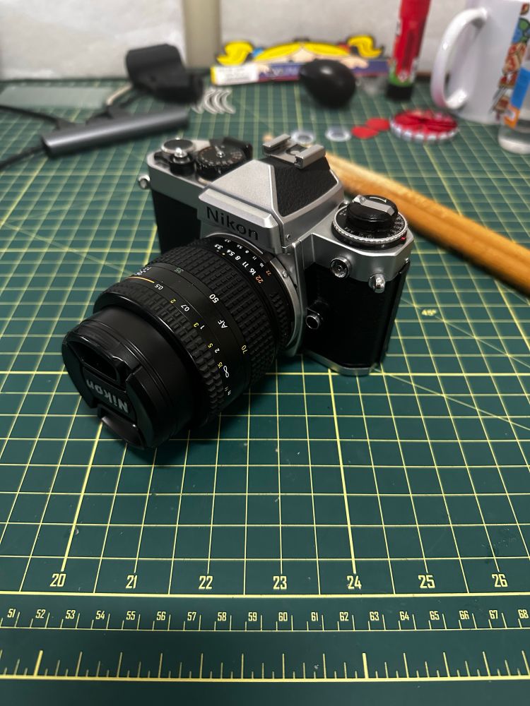 a Nikon FE film camera on a table