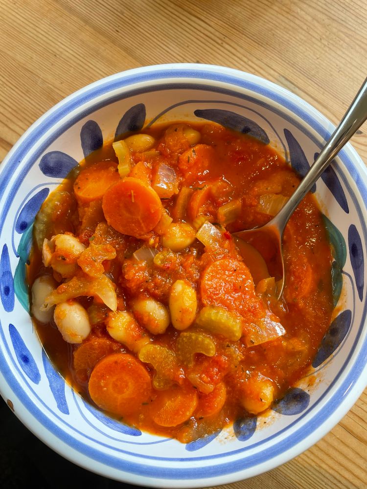 A bowl of butter bean and tomato soup 