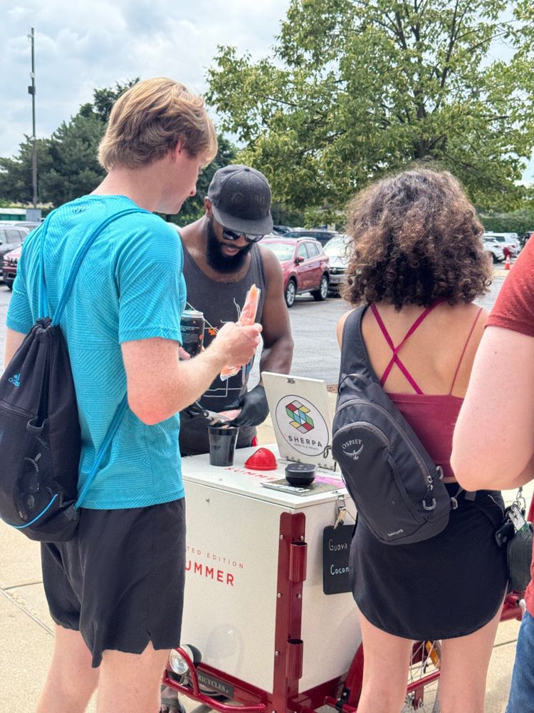 Dietrich serves popsicles out of the Serpa Pedal Cafe freezer bike