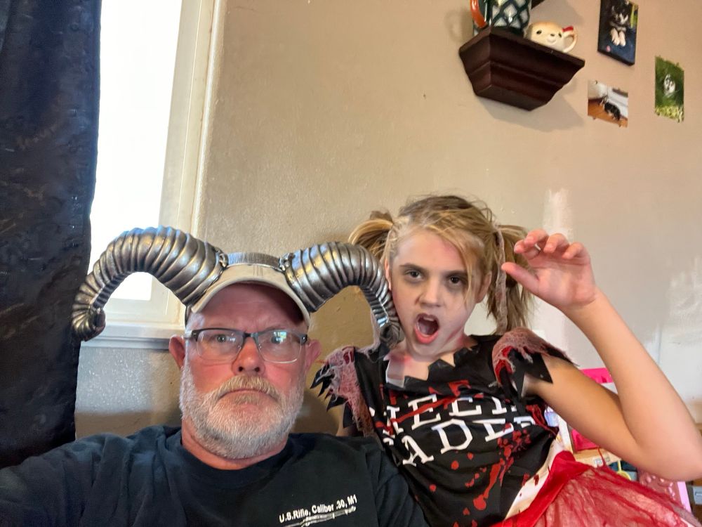 Pop pop and number one granddaughter dressed in Halloween costumes (an old goat with horns and a zombie “drear leader”