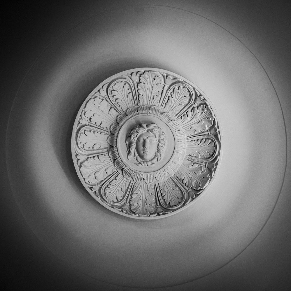 A roundel with acanthus leaves radiating from the centre where the head of a woman with snakes for hair glares at the viewer. Found at the Bank of England Museum. 