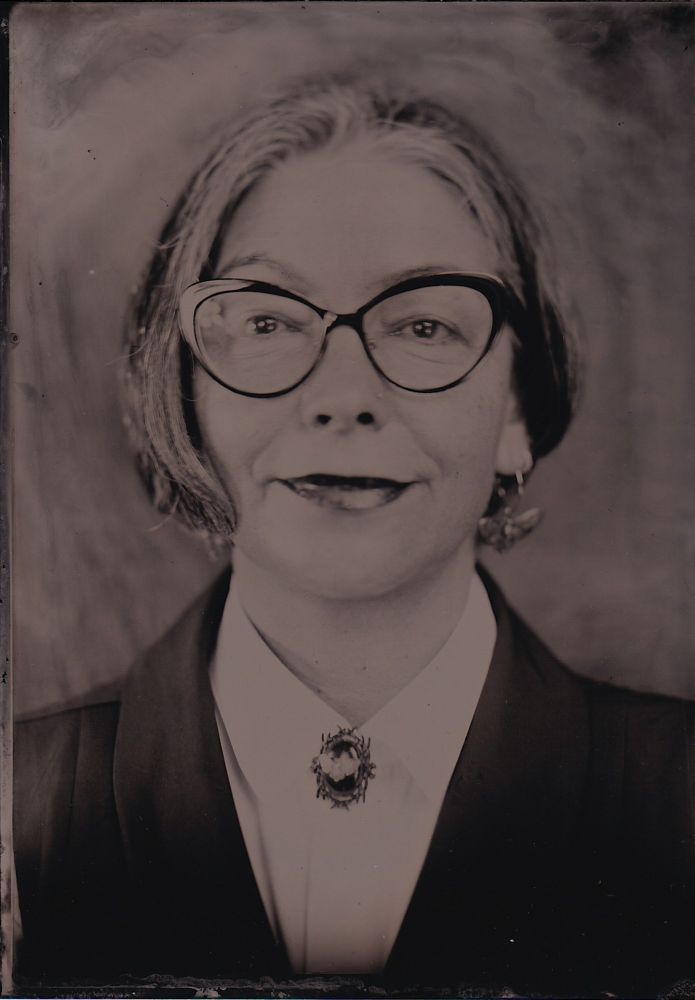 Vintage image of woman with short hair wearing glasses. 