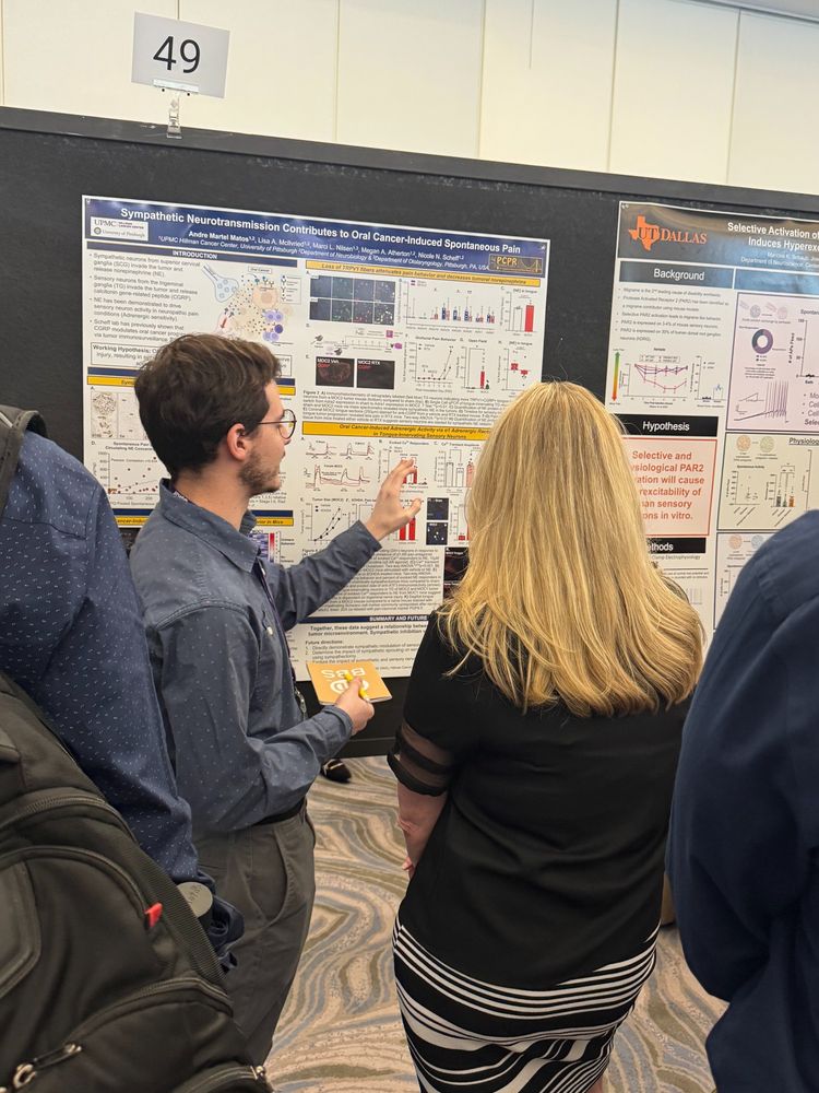 Graduate student Andre Martel Matos presents his poster entitled "Sympathetic Neurotransmission Contributes to Oral Cancer-Induced Spontaneous Pain" to several conference attendees