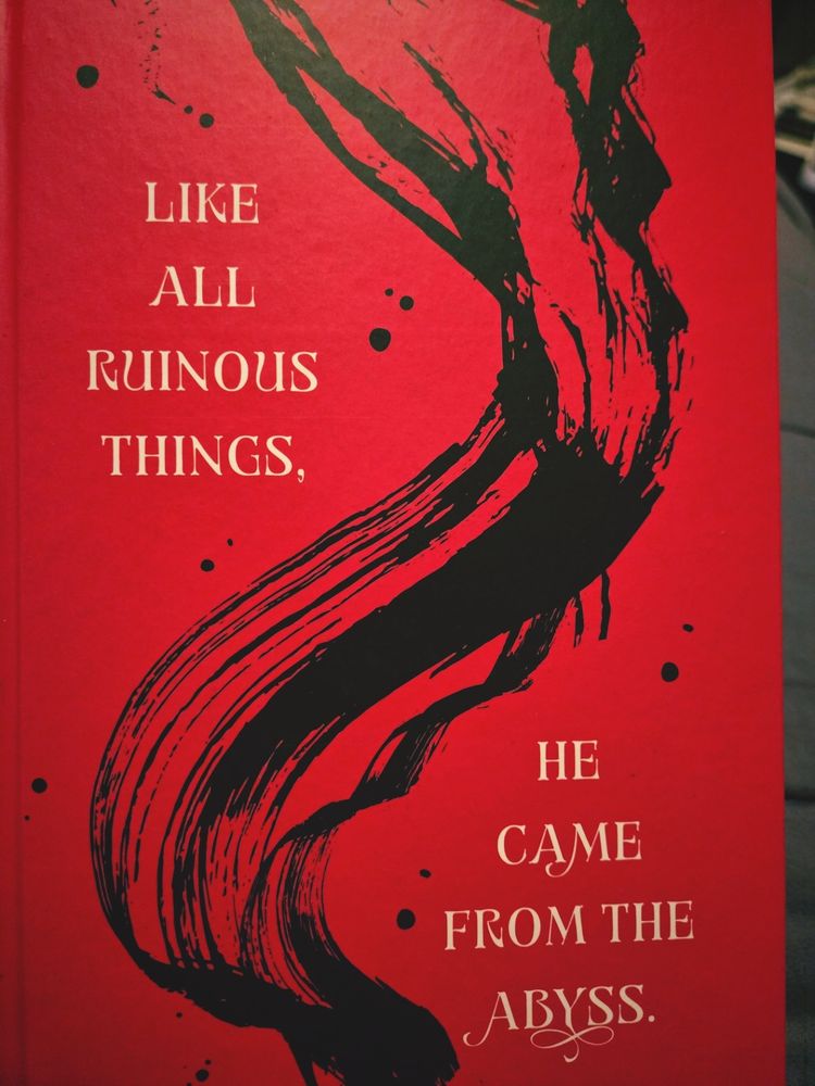 The cover of the book reads "Like all ruinous things, he came from the abyss."
