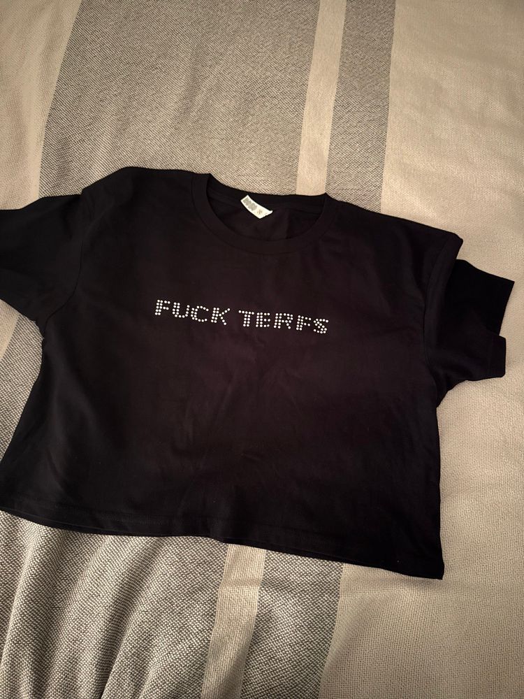 T-shirt that says “fuck TERFS” in bedazzled letters