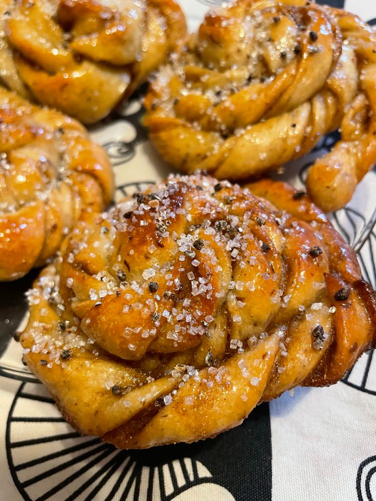 Close up of all that tasty cademom and sugar on a perfectly golden sweet bread