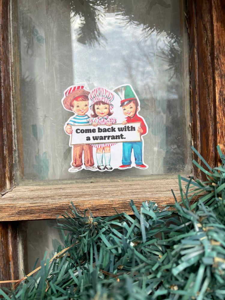sticker on door of cute 50s style cartoon kids holding a sign that reads, “come back with a warrant.”
