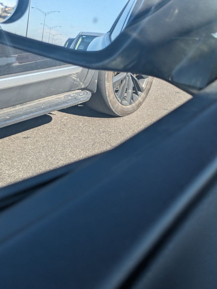PoV: You're at an intersection and the car next to you has bald tires.