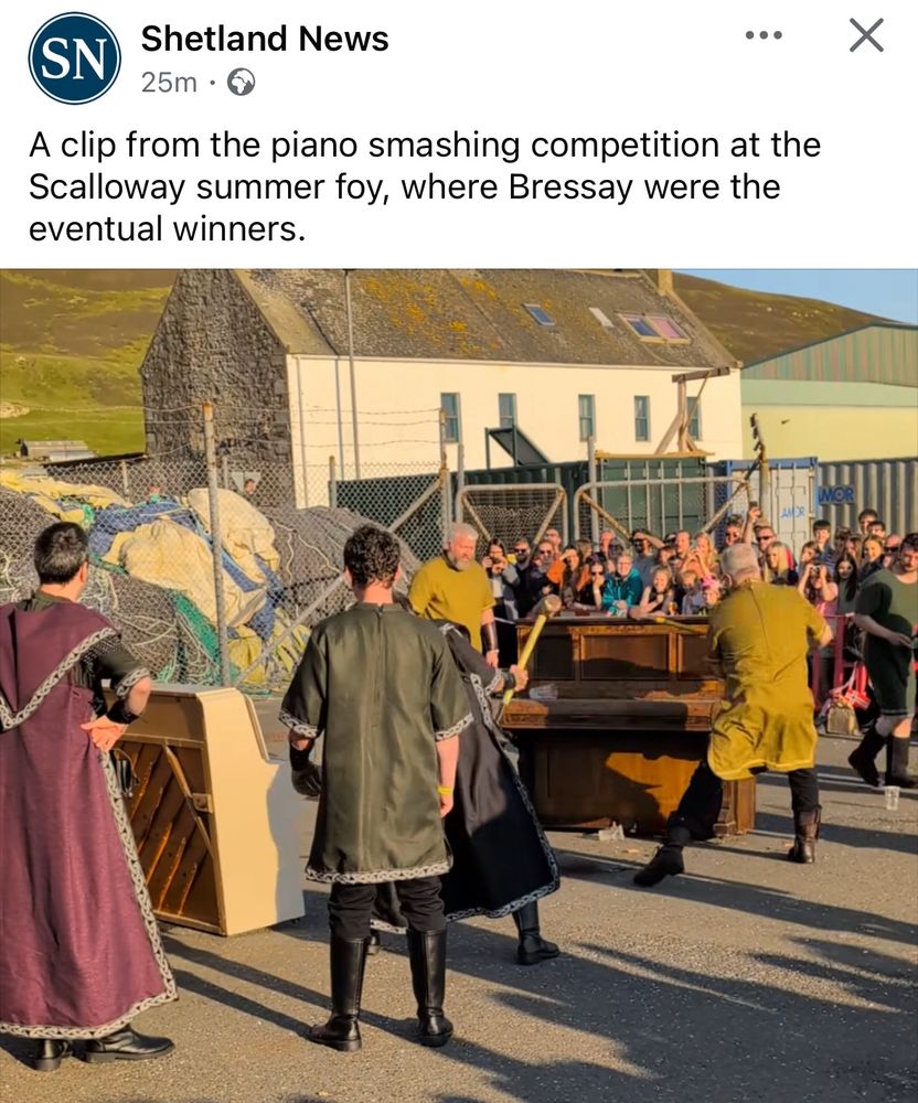 Image shows a post from Shetland News that reads “a clip from the piano smashing competition at the Scalloway summer foy, where Bressay were the eventual winners” beneath it is a still from a video clip, where a bunch of men dressed in Viking cloaks are taking hammers and axes to two old pianos. 