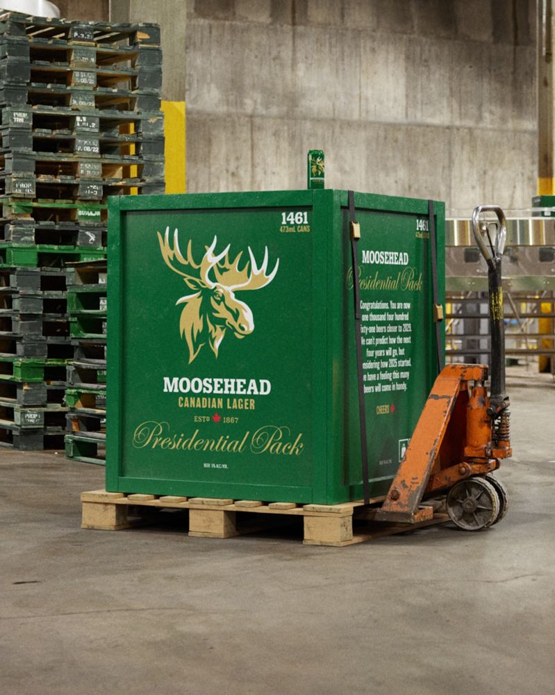 Image of a crate called the "Presidential Pack" on a pallet and loaded on a forklift. The Presidential Pack has 1461 beers in it, one for each day of Mango Mussolini's reign.