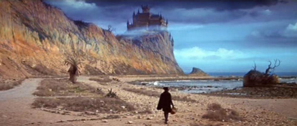 A man in search of his wife approaches a mist-covered castle atop a cliff 