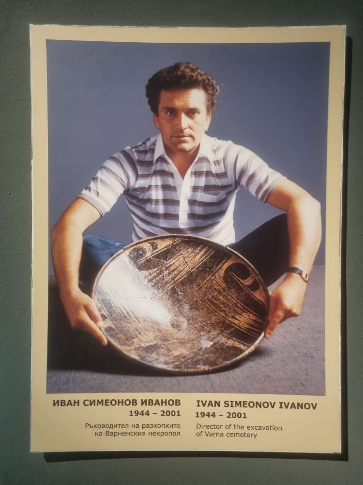 A poster featuring the archaeologist Ivan Simeonov Ivanov posing with a copper age bowl and being rather intense about it.