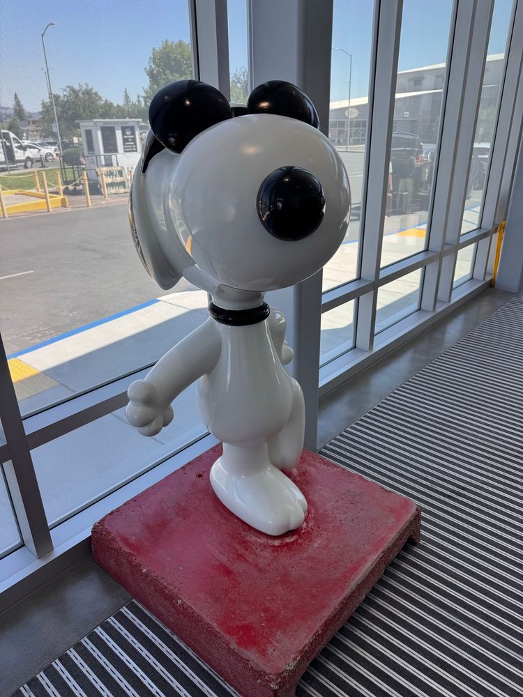 Snoopy in aviator shades greeting travelers at the airport in Santa Rosa. 